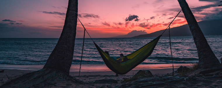 hammock on beach at sunset